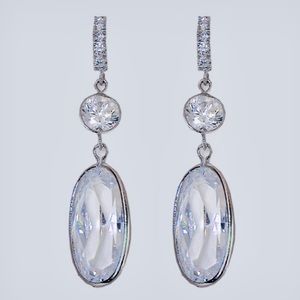 Oval Drop CZ Earrings. Pave encrusted hook, hangs at 1 5/8”